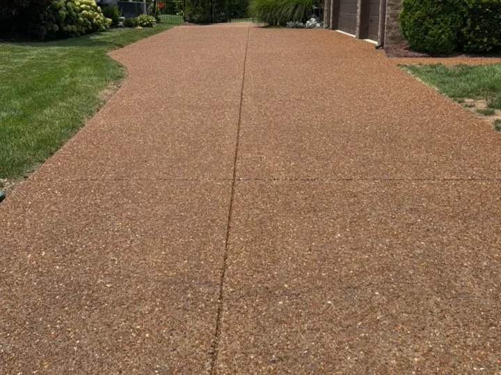 Exposed aggregate driveway cleaned and sealed — after professional cleaning in Franklin, TN